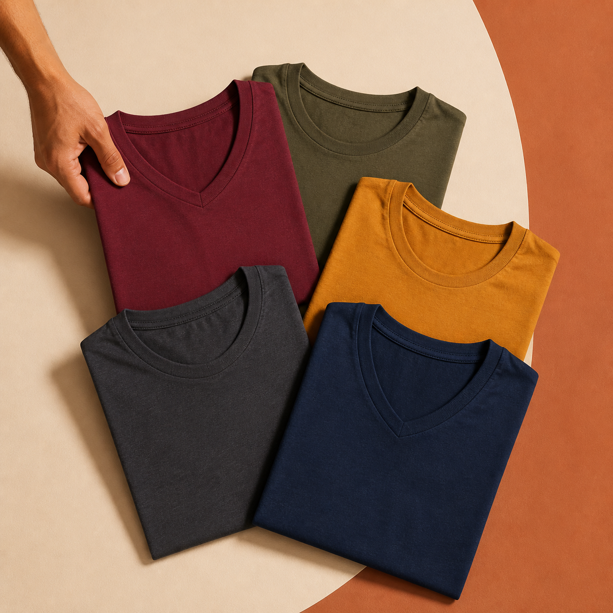 Five solid-colour cotton T-shirts arranged for a Build Your Pack selection